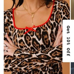 Dressed in LALA Mama Muse Leopard Print Long Sleeve Top with Red Accents